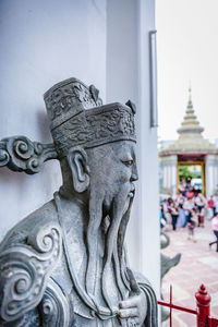 Close-up of statue against building