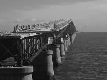 Pier over sea against sky