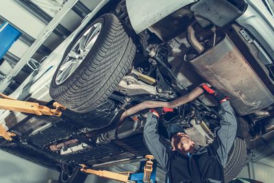 Mechanic repairing car