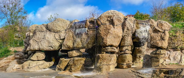  uman, ukraine. waterfall in the fantasy park nova sofiyivka, uman, ukraine, on a sunny autumn day