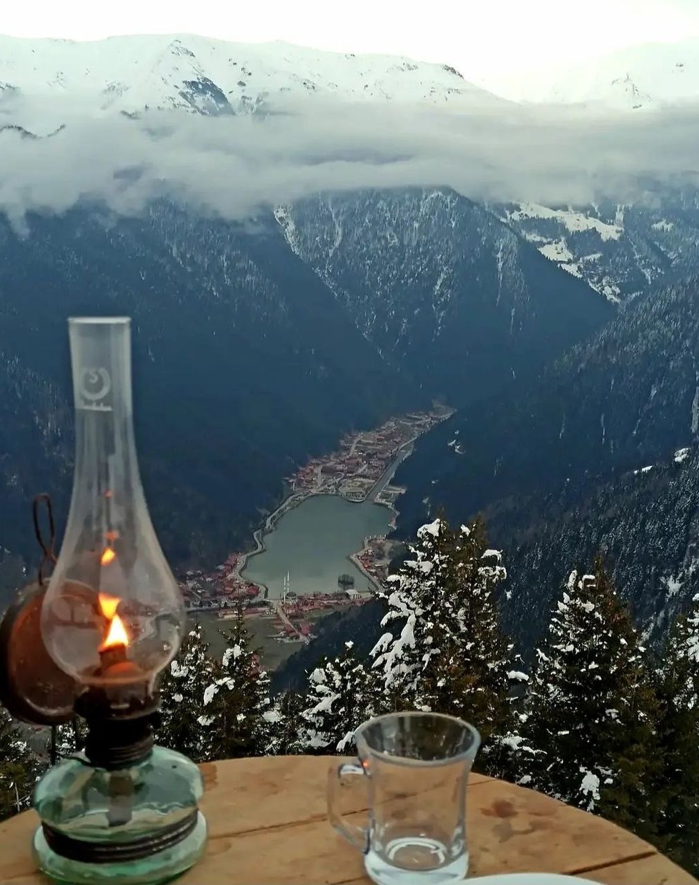 mountain, nature, table, glass, cold temperature, no people, drinking glass, food and drink, snow, environment, mountain range, winter, scenics - nature, beauty in nature, drink, household equipment, refreshment, water, outdoors, sky, alcohol, landscape, day, candle
