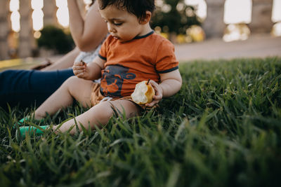 Cute boy on grass