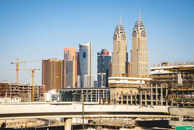 Modern buildings in city against sky