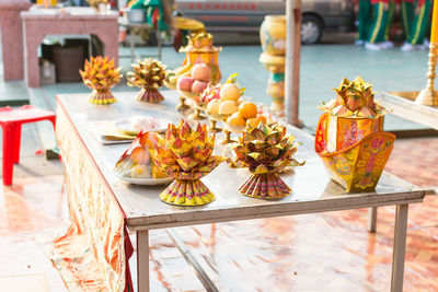 Religious offerings on table outside temple