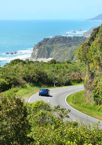 High angle view of car by sea against sky