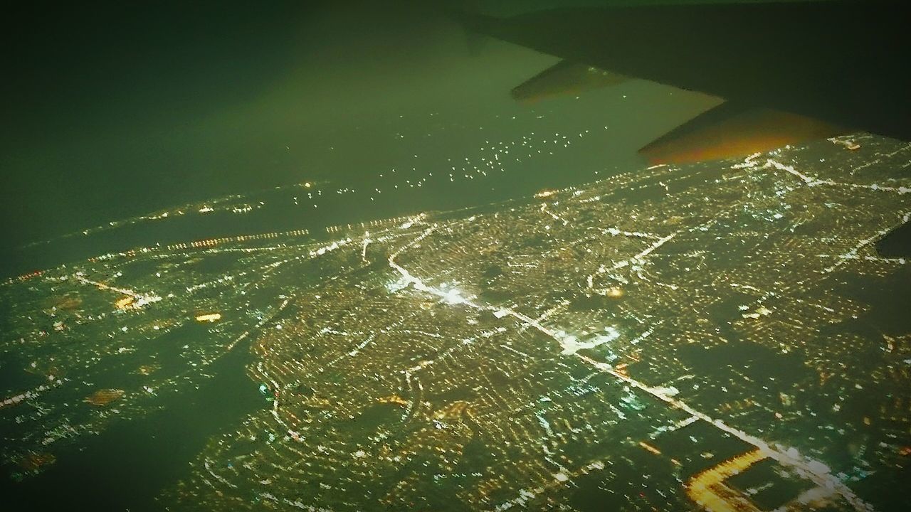 aerial view, cityscape, city, architecture, building exterior, night, high angle view, built structure, illuminated, crowded, outdoors, no people, sky, nature, residential district, landscape, city life, skyscraper, water, residential building