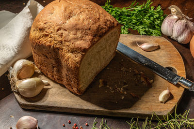 High angle view of bread on cutting board