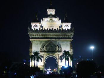 Low angle view of illuminated building at night