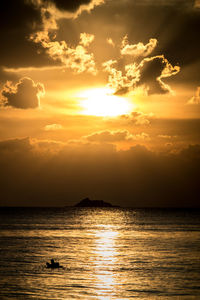 Scenic view of sea against orange sky