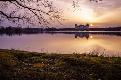 Scenic view of lake at sunset