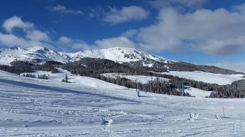 Scenic view of snowcapped mountains against sky