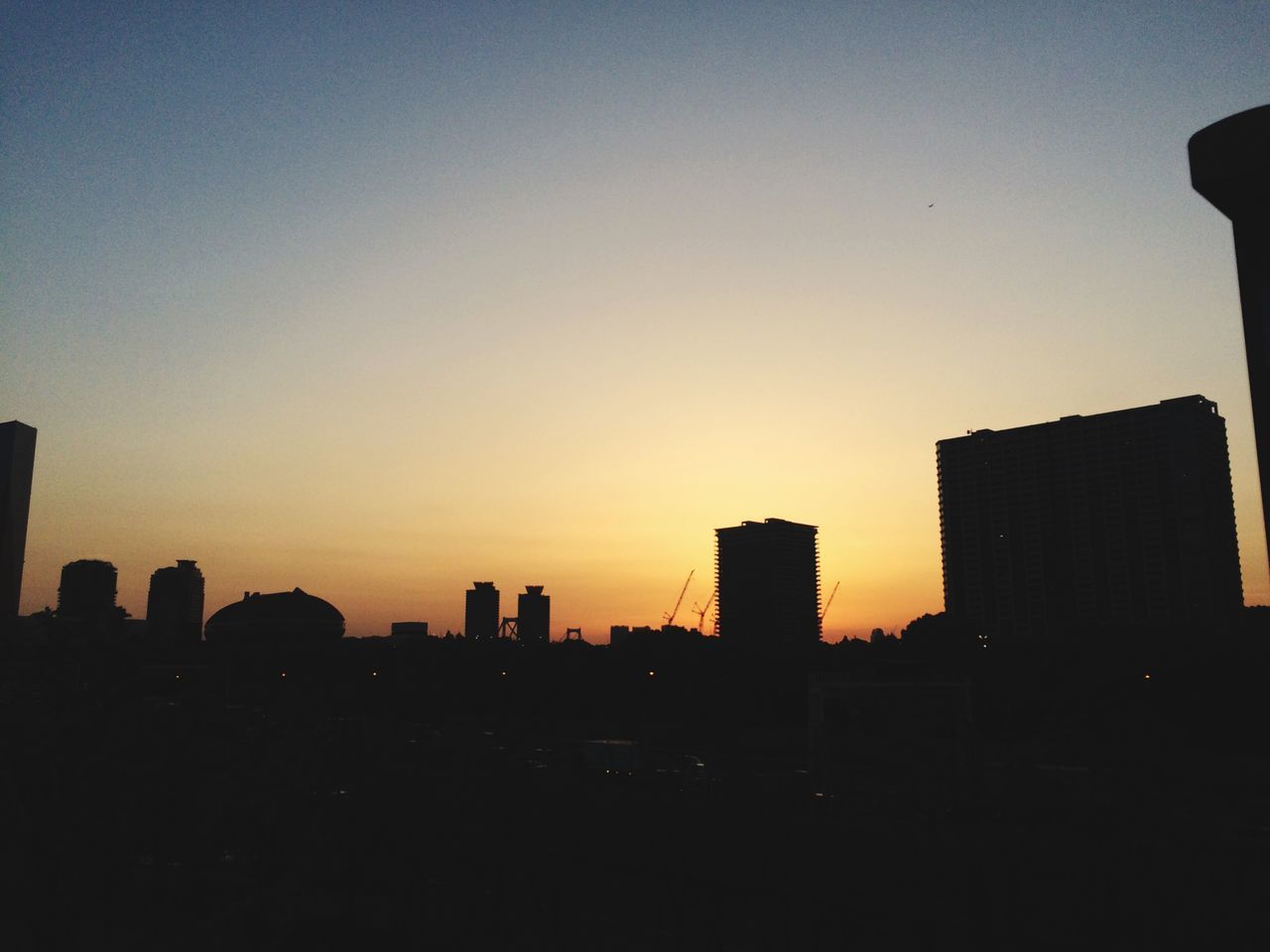 silhouette, building exterior, sunset, architecture, built structure, copy space, city, clear sky, cityscape, skyscraper, dark, urban skyline, orange color, outline, building, sky, tower, skyline, tall - high, dusk