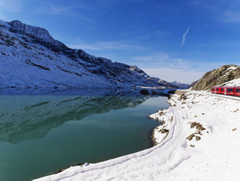 Scenic view of mountains against cloudy sky
