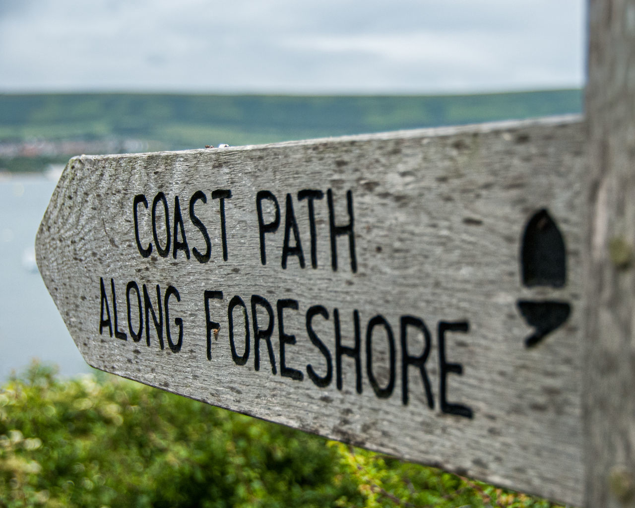 CLOSE-UP OF TEXT ON BEACH