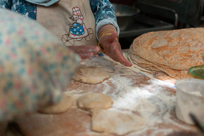 Midsection of woman preparing food