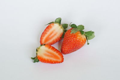 Close-up of strawberry over white background