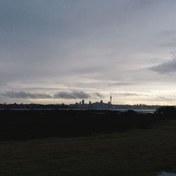 Scenic view of landscape against cloudy sky