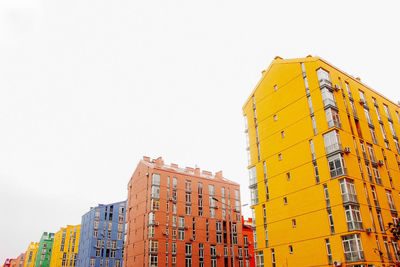 Low angle view of buildings against clear sky