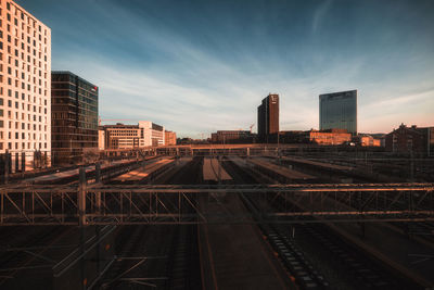 High angle view of railroad station in city against sky