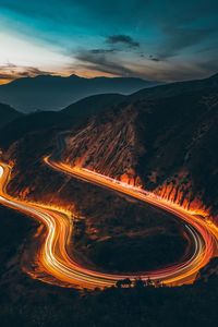High angle view of light trails on road against sky at night