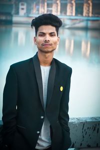 Portrait of young man standing outdoors