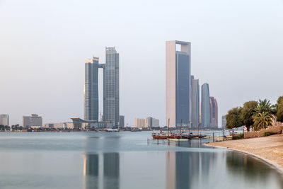 Abu dhabi skyline early morning. establishing shot.