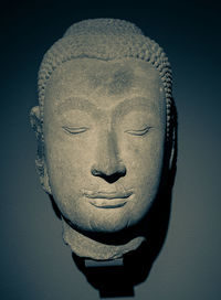 Close-up of statue against black background