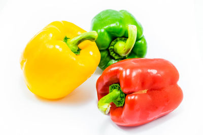 Close-up of bell peppers against white background