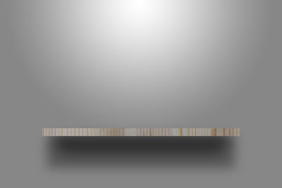 Close-up of piano over white background