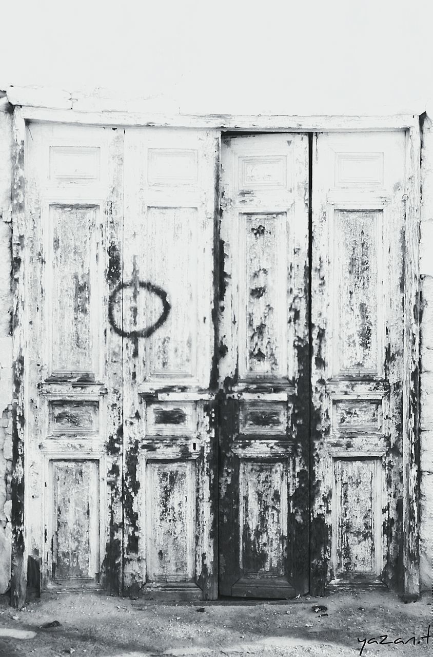 door, built structure, architecture, closed, abandoned, building exterior, old, run-down, weathered, obsolete, damaged, wood - material, house, deterioration, entrance, safety, wall - building feature, day, wooden, security