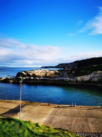 Scenic view of sea against blue sky