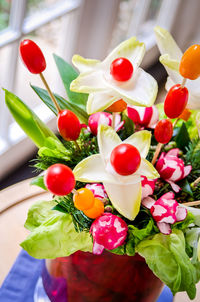 High angle view of red berries on table