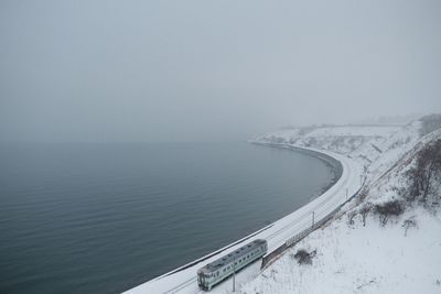 Scenic view of sea against clear sky during winter