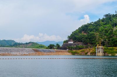 Scenic view of mountain against cloudy sky