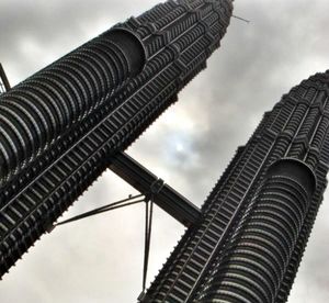 Low angle view of tower against cloudy sky