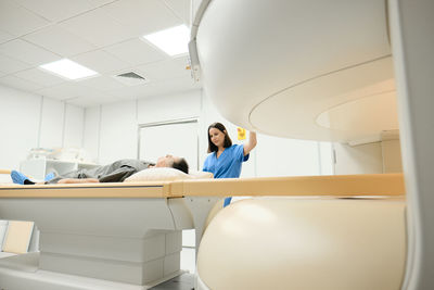 Doctor examining patient in hospital