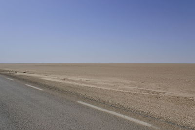 Scenic view of desert against clear sky