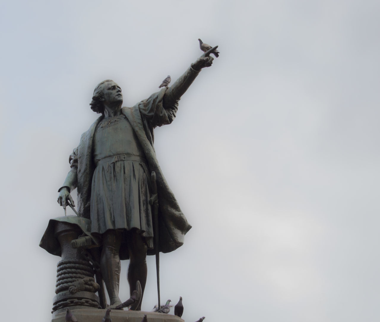 statue, human representation, sculpture, low angle view, male likeness, art and craft, female likeness, sky, day, outdoors, clear sky, no people, travel destinations