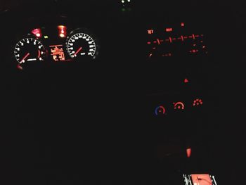 Low angle view of illuminated lighting equipment in car