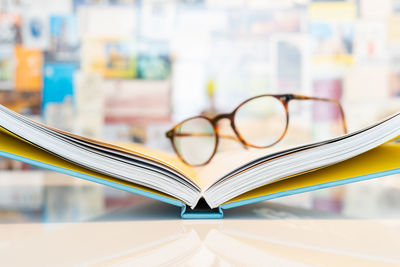 Close-up of eyeglasses on book