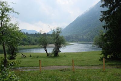 Scenic view of lake against cloudy sky