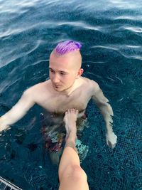 High angle view of woman swimming in pool