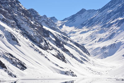 Scenic view of snow covered mountains against sky