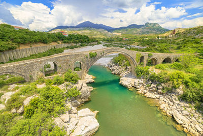 High angle view of bridge over mountains against sky