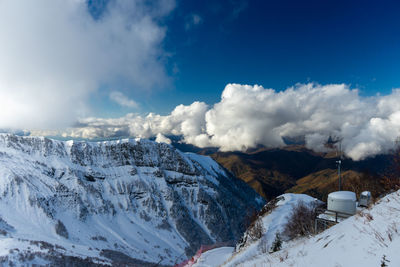 Scenic view of snowcapped mountains against sky