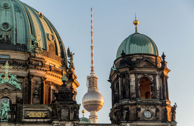 Low angle view of cathedral against buildings