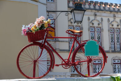 Bicycle parked by building