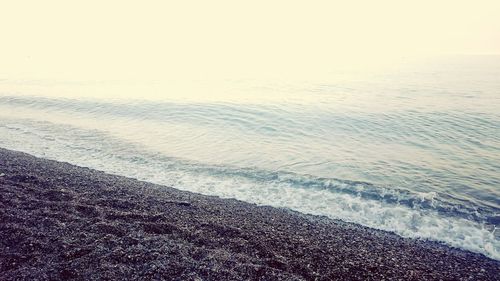 Scenic view of beach against clear sky