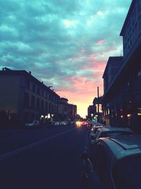 Traffic on road at sunset