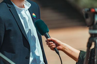 News reporters interviewing a businessman or politician